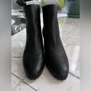 DKNY black ankle boots with gold zippers and accents. Women’s size 7